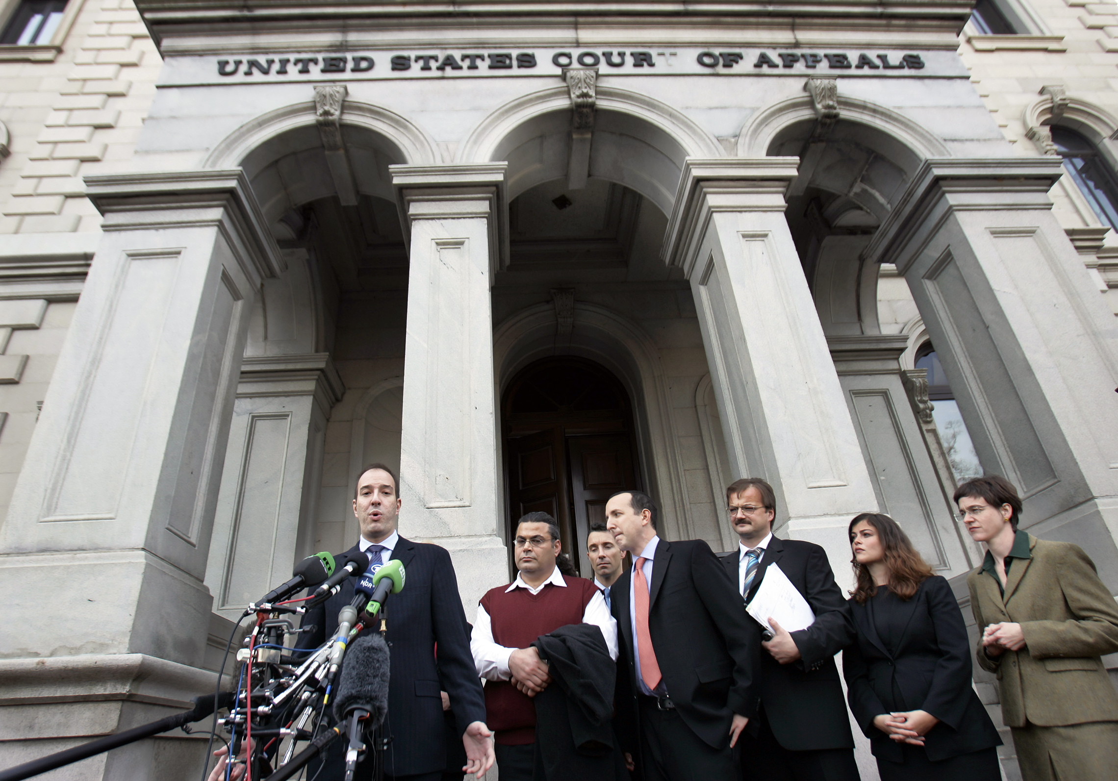Anthony Romero, left, executive director of the American Civil Liberties Union, speaks to reporters as Khaled El-Masri, second from left, listens outside Federal Court, after a hearing before the 4th US Circuit Court of Appeals, Tuesday, Nov. 28, 2006, in Richmond, Va. El-Masri wants the 4th U.S. Circuit Court of Appeals to reinstate his lawsuit alleging human rights and due process violations by former CIA director George Tenet and others. (AP Photo/Steve Helber)