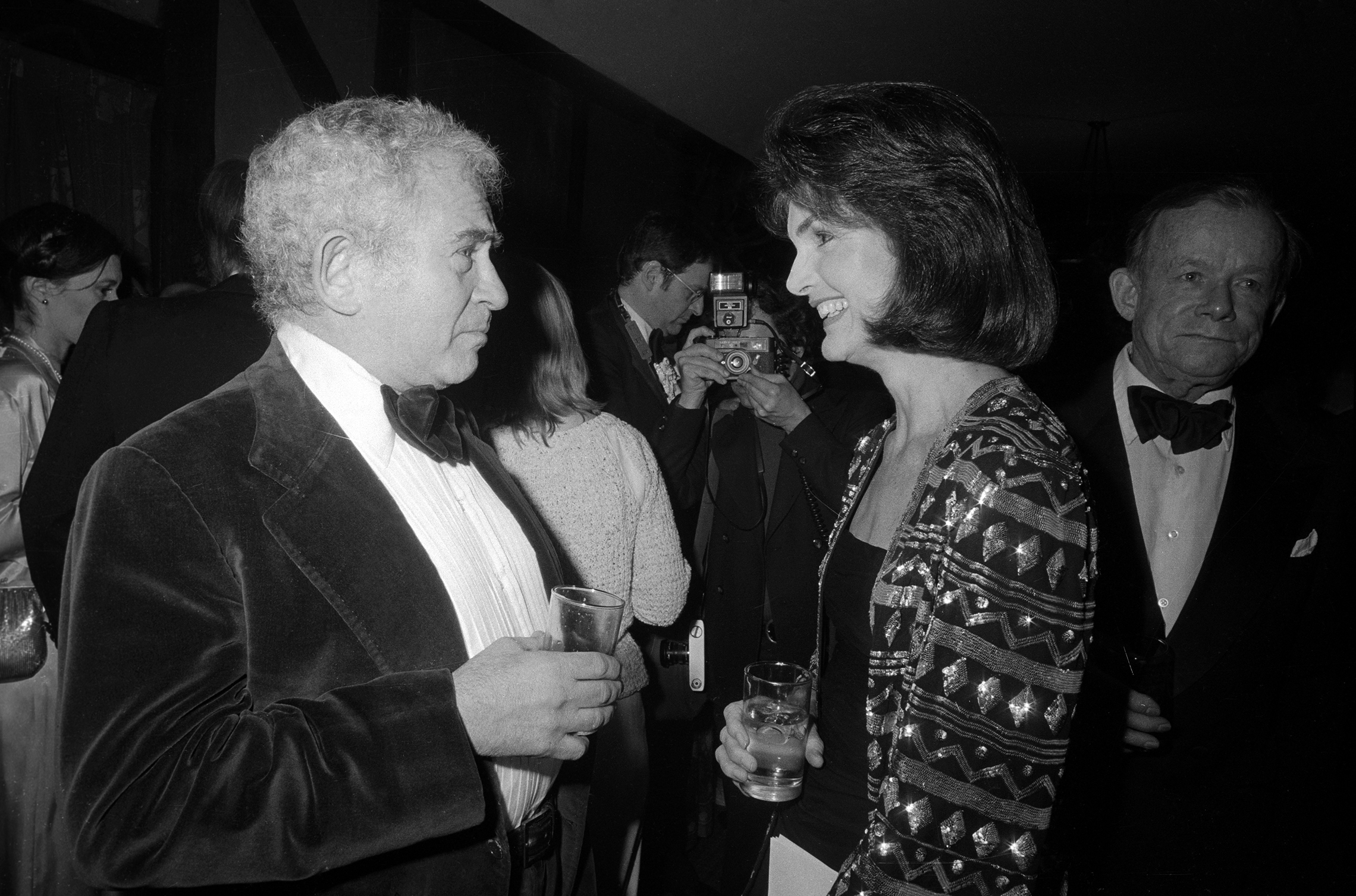 Author Norman Mailer chats with Jacqueline Kennedy Onassis at a publisher's party in New York City, February 22, 1978. (© Bettmann/CORBIS )